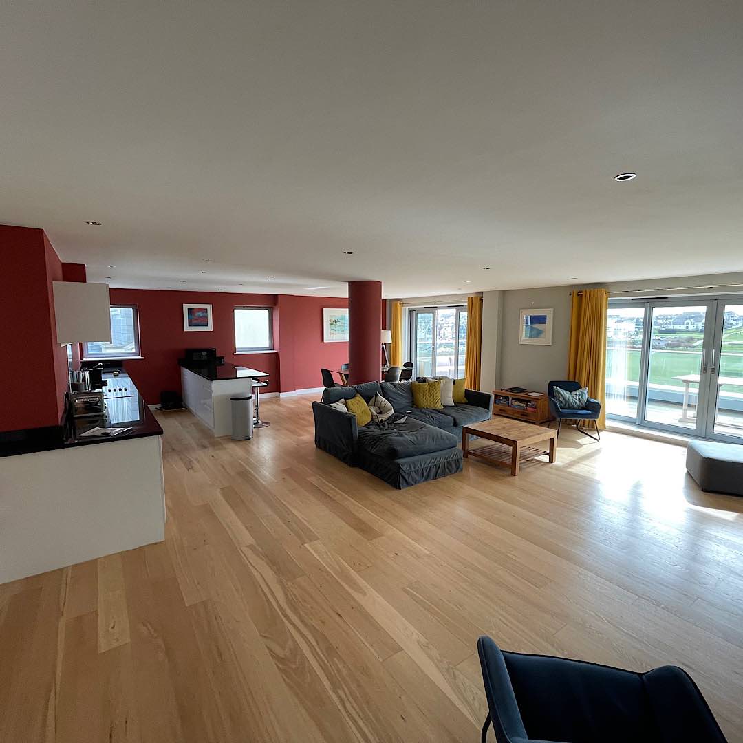 open plan self catering lounge, dining and kitchen in self catering apartment