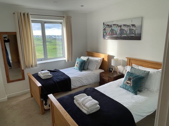 Twin bedroom with seaviews across Newquay golf course and the Fistral Beach surf.