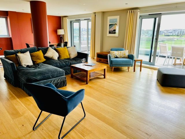 Large luxurious lounge with stunning views of Newquay golf course and the surf on Fistral Beach, Cornwall