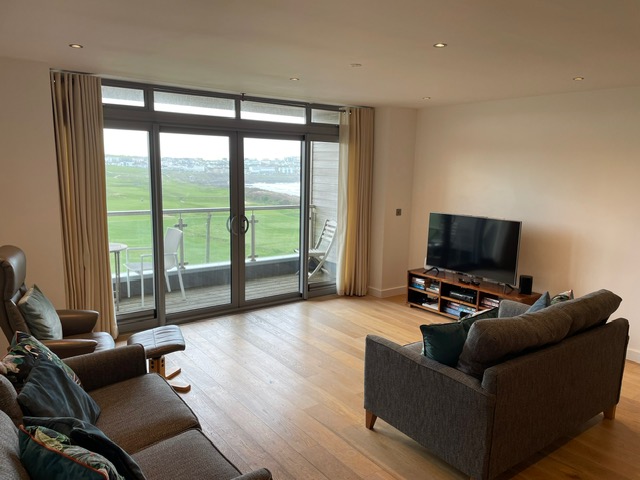 Relax in the perfect lounge for a modern self catering apartment with views over Fistral Beach and Newquay golf course. 