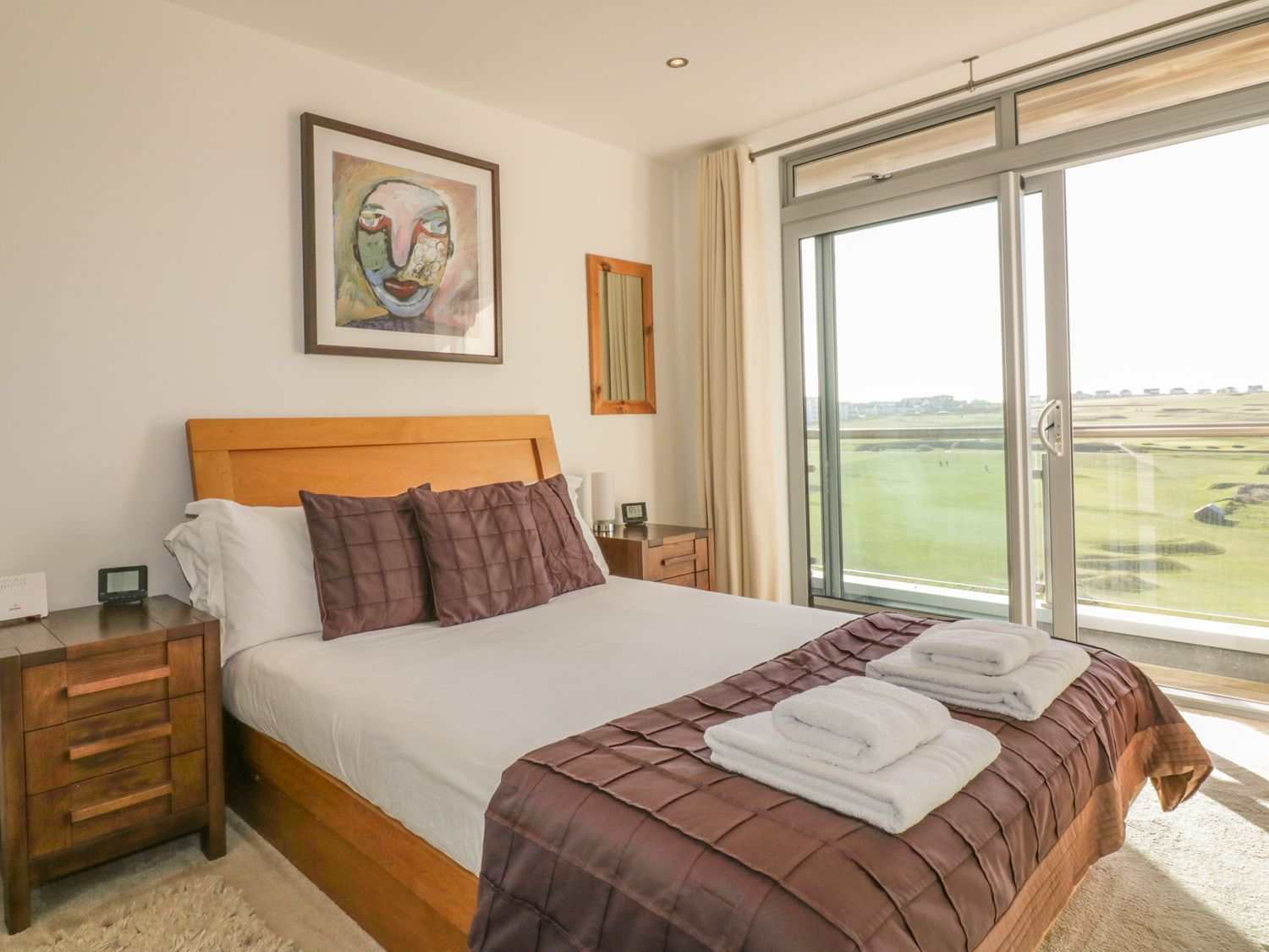 Main bedroom with ensuite and  sea views across Newquay golf course and the Fistral Beach surf.